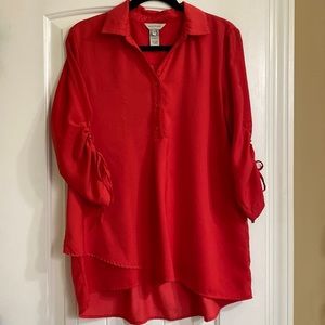 Red blouse with asymmetrical hem